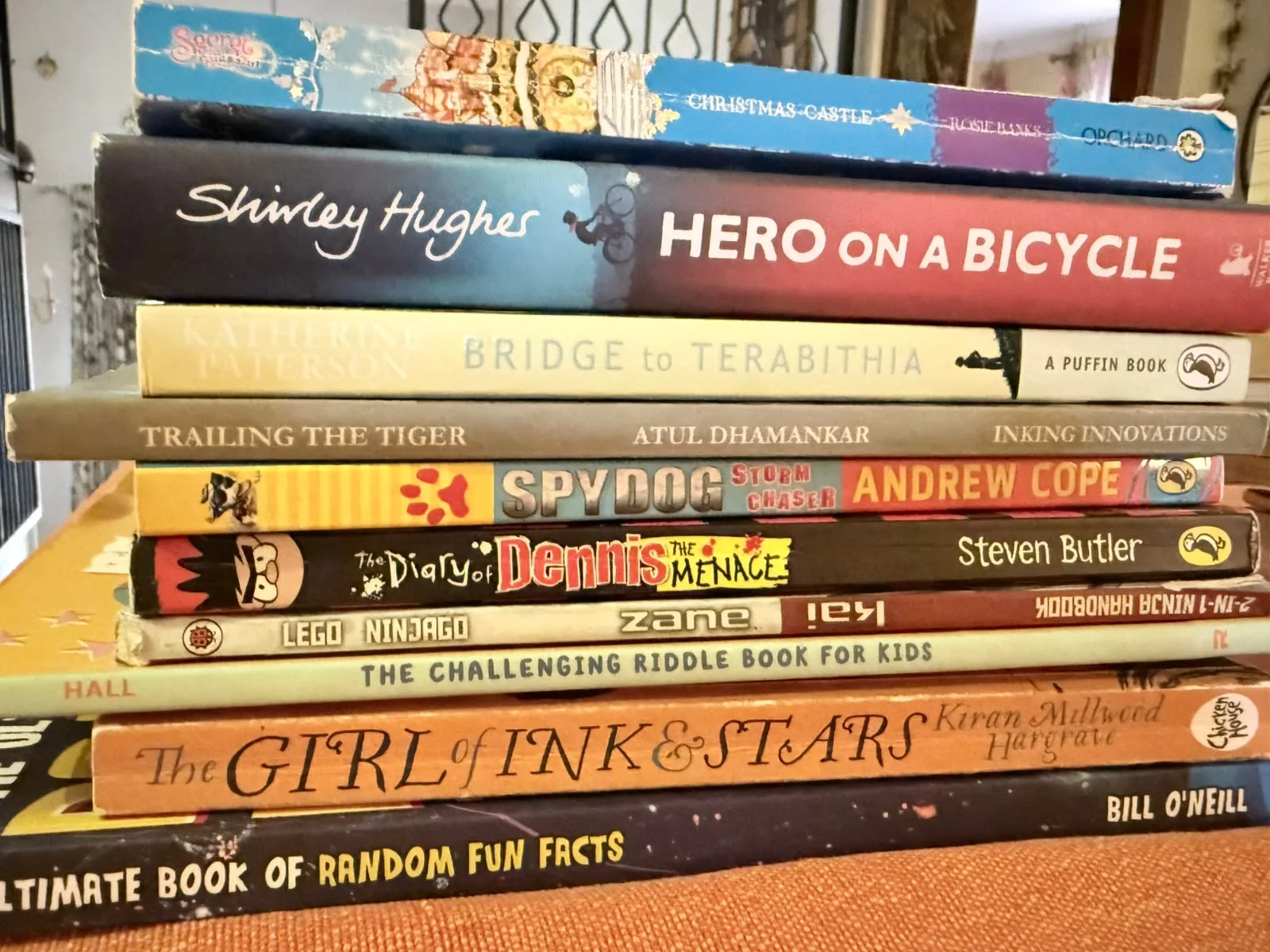 A stack of donated children’s storybooks, spines facing out